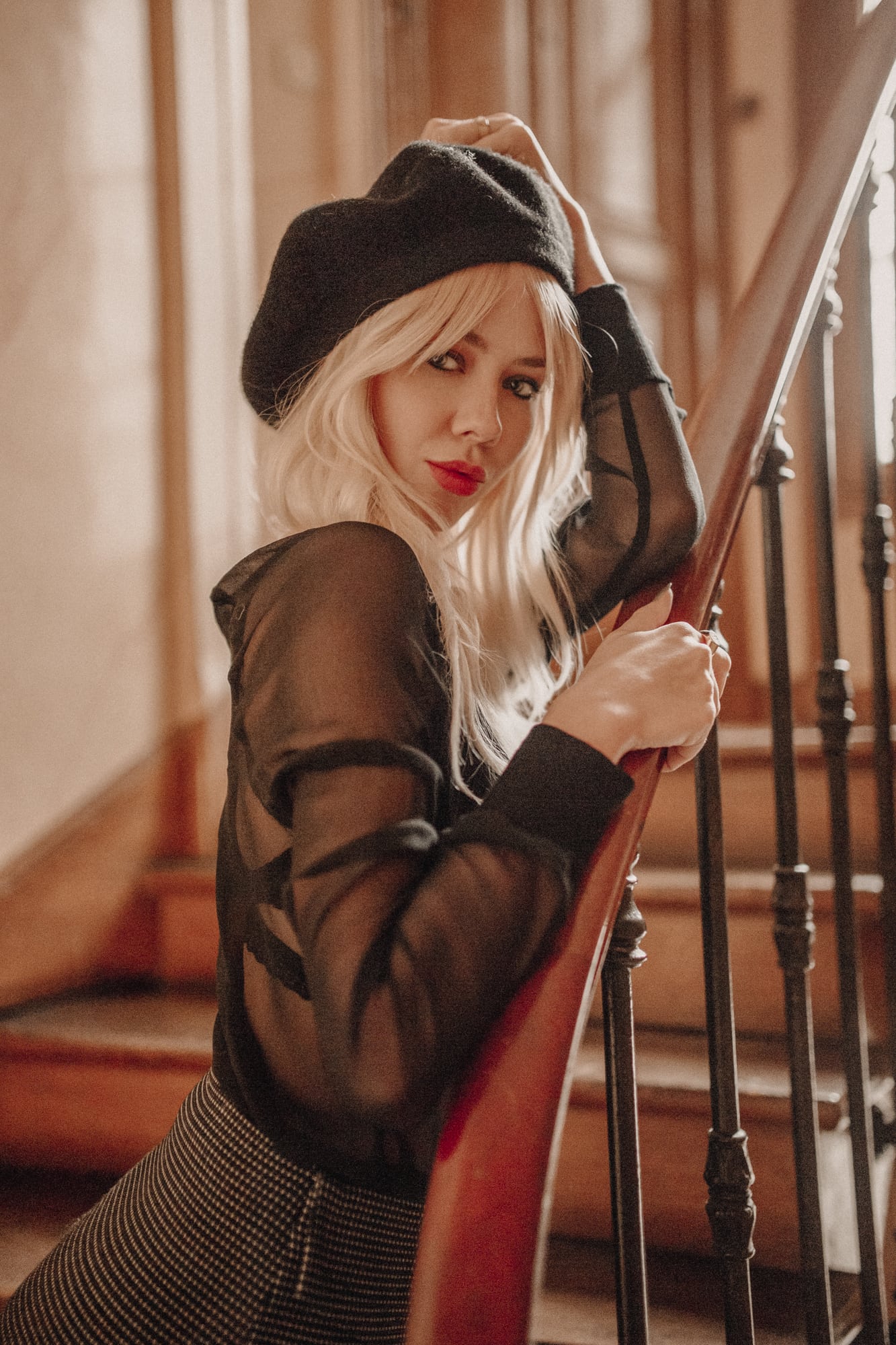 Sarah Loven wears vintage French style on Paris staircase